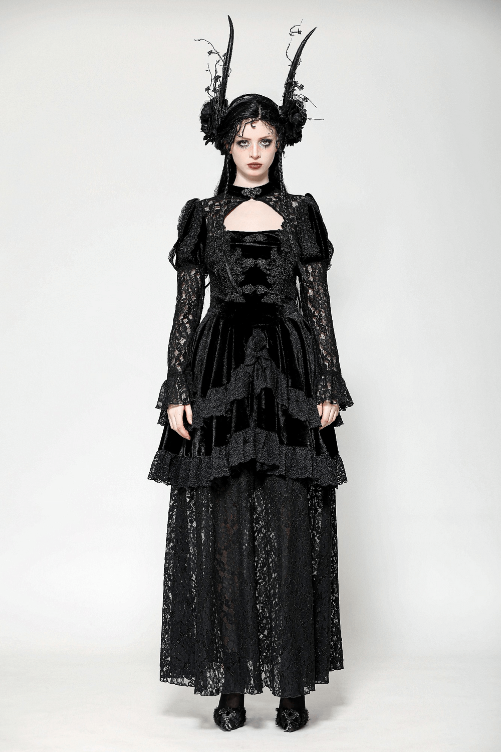 Sleek Gothic lace tiered dress with velvet accents, perfect for a dramatic, darkly elegant look.