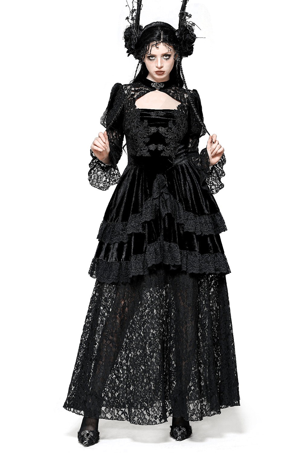 Sleek gothic lace tiered dress with velvet accents, featuring long sleeves and intricate lace detailing.