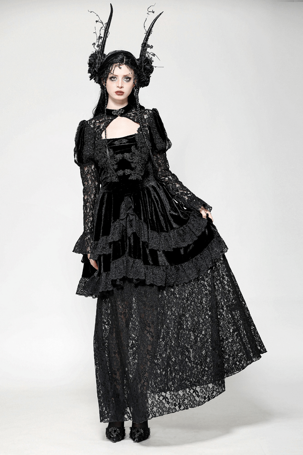 Sleek Gothic lace tiered dress with velvet accents, showcasing dark elegance and unique style.