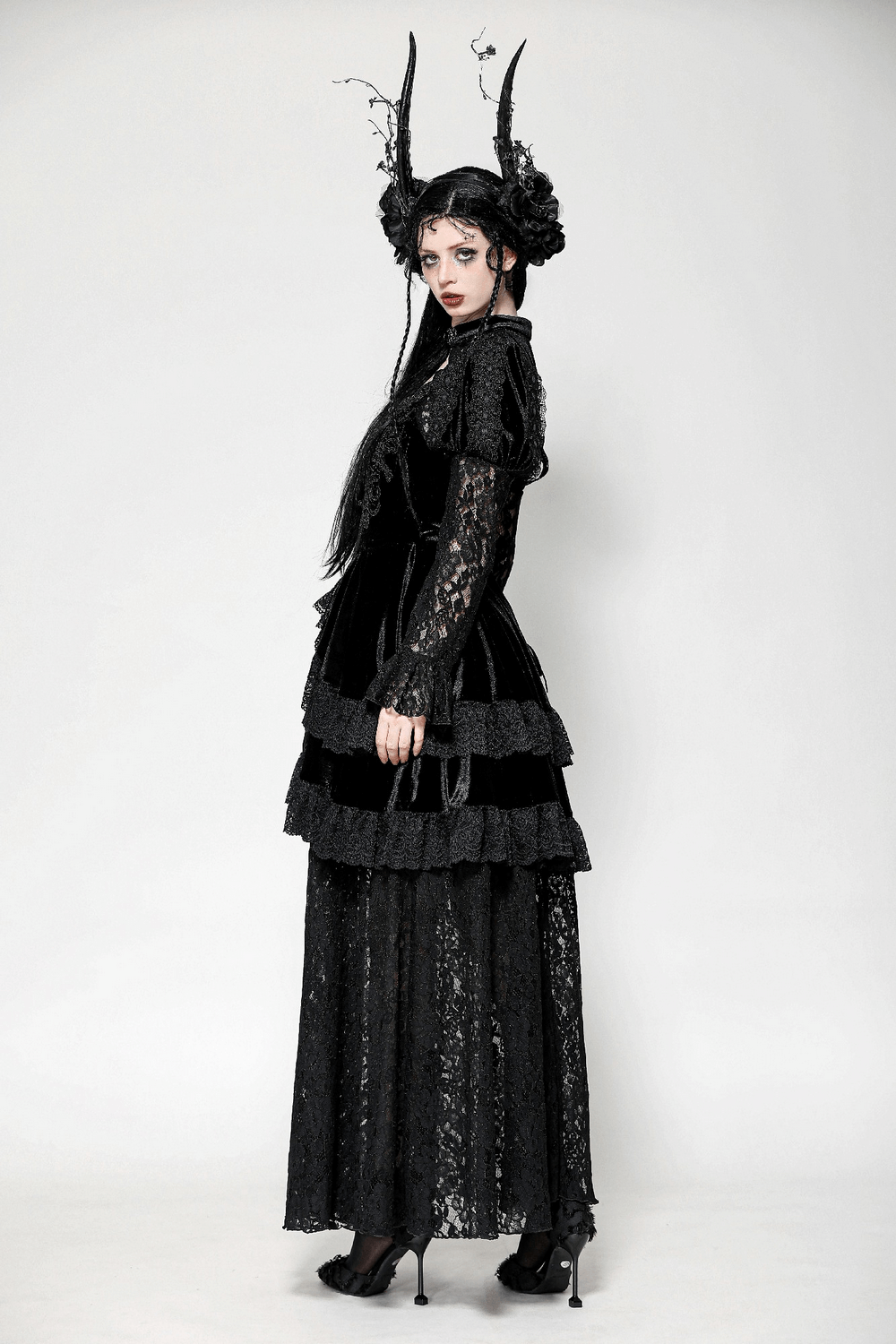 Sleek Gothic lace tiered dress with velvet accents, featuring a darkly elegant silhouette.