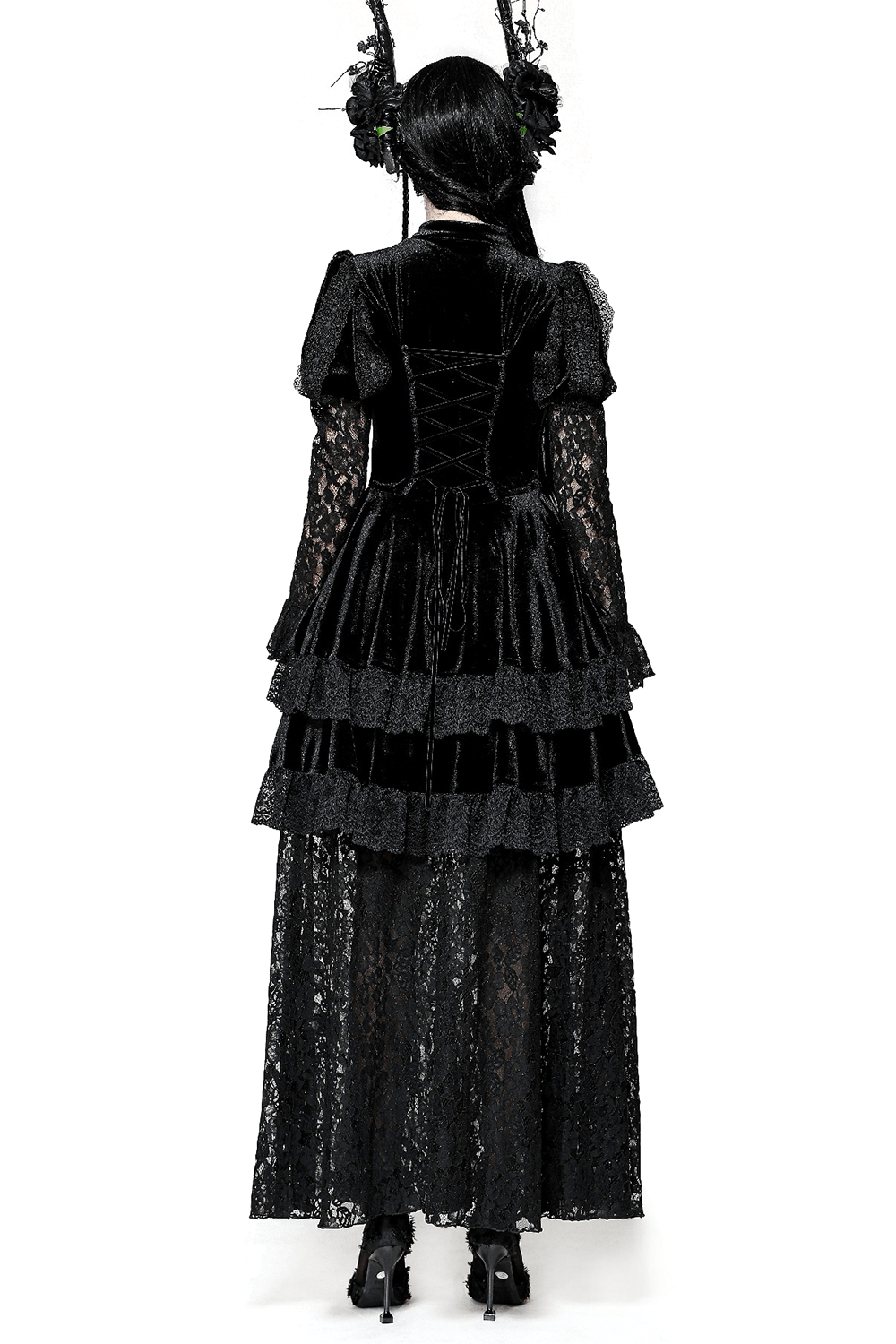 Back view of a sleek gothic lace tiered dress featuring velvet accents and elegant puffed sleeves.