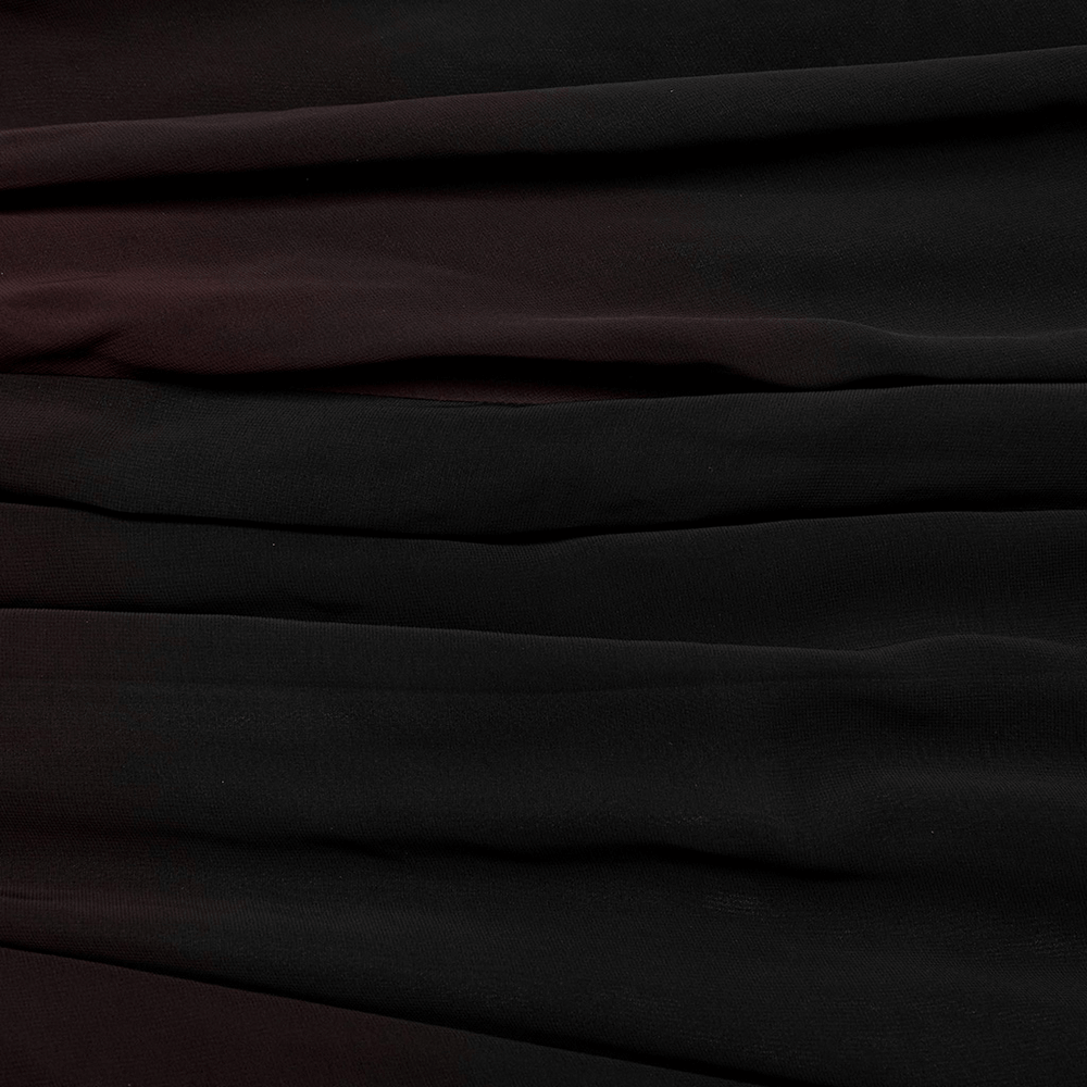 Textured black fabric showcasing layers, perfect for a sleek gothic long dress with adjustable straps.