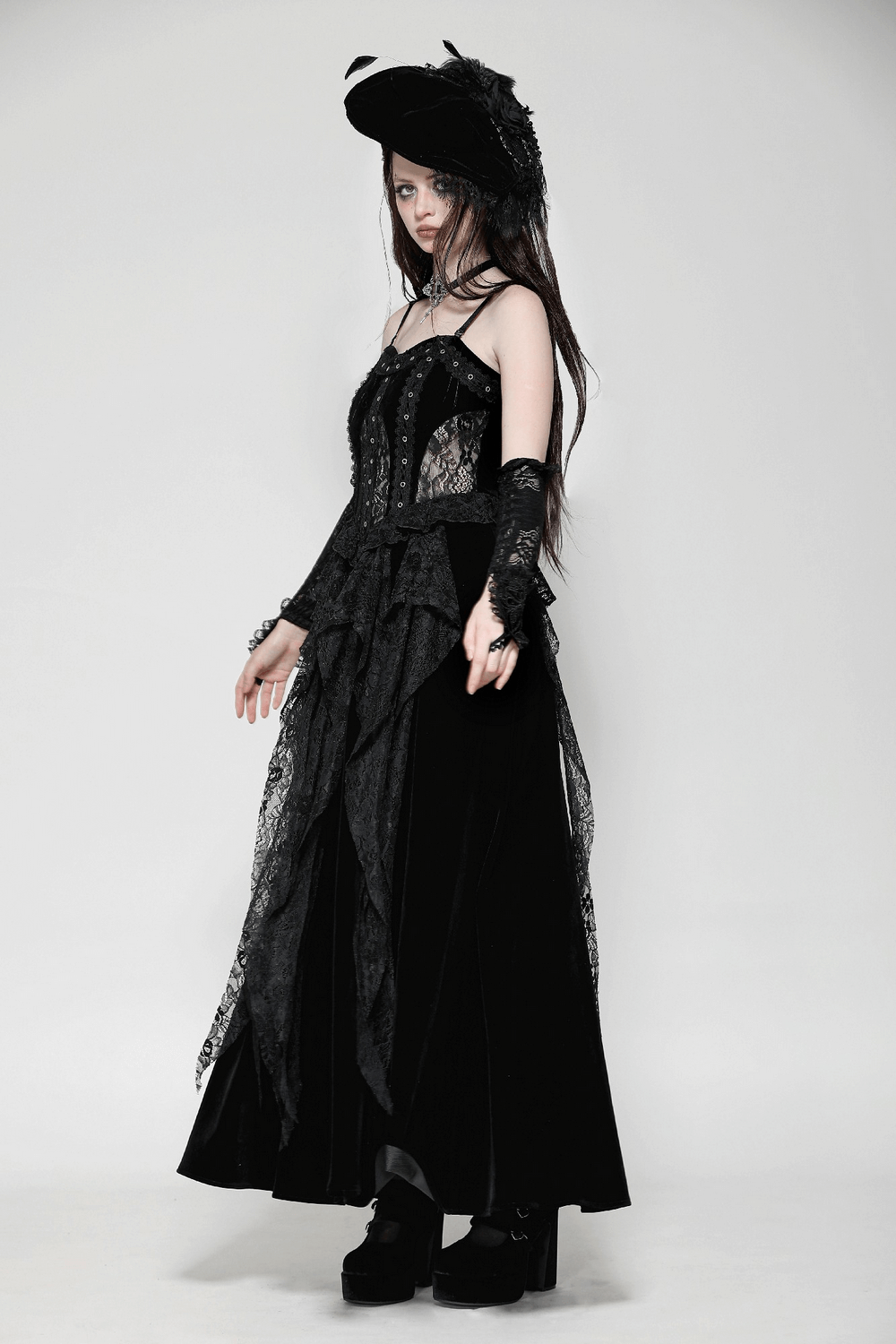 Dark romantic corset dress with lace details, flowing velvet skirt, and gothic accessories for dramatic style.