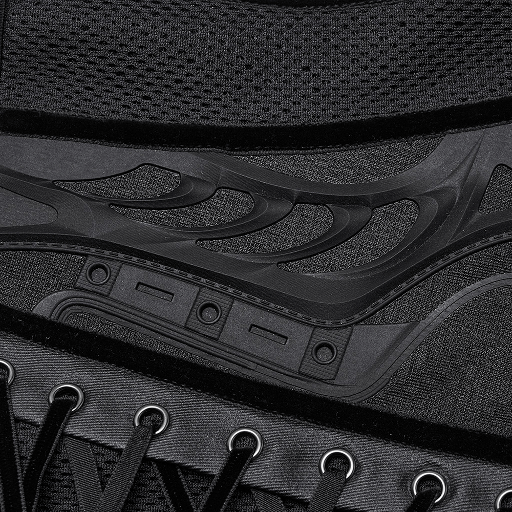 Close-up of sleek black underbust corset detailing, showcasing mesh and rubberized fabric with lace-up design.