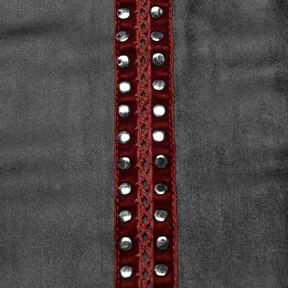Close-up of sleek rivet webbing detail on a punk dress showcasing red accents and silver studs for edgy style.