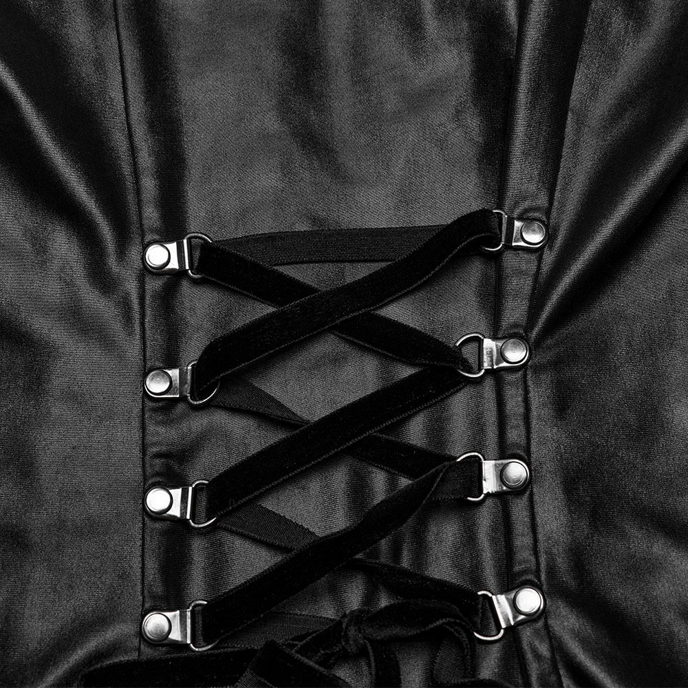 Close-up of sleek black dress with curved rivet webbing and adjustable straps for a punk style.