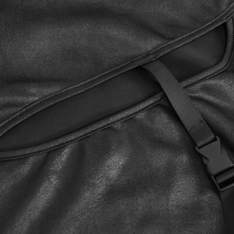 Close-up of a gothic black fitted top featuring unique cutout and buckle details, highlighting modern alternative fashion.