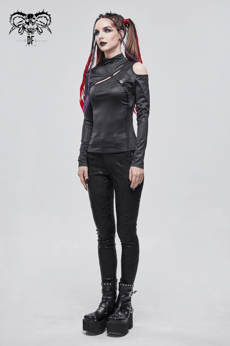 Gothic women's black long sleeve top with cutouts and fashionable fitted style, paired with stylish platform boots.