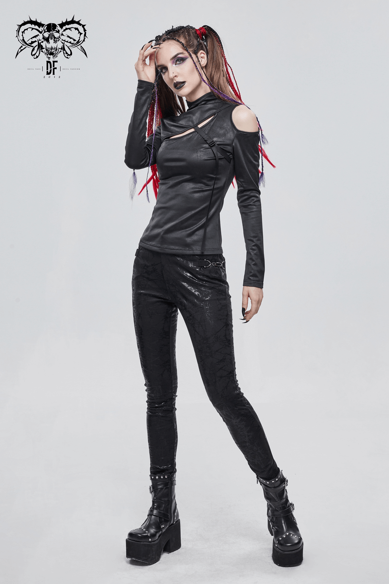 Gothic black long sleeve cutout top for women, paired with stylish black leggings and platform boots.