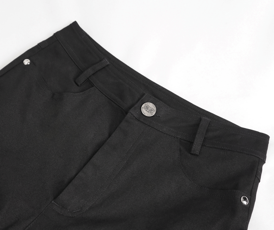 Close-up of women's slim-fit black pants featuring punk zipper pockets and stylish metal details.