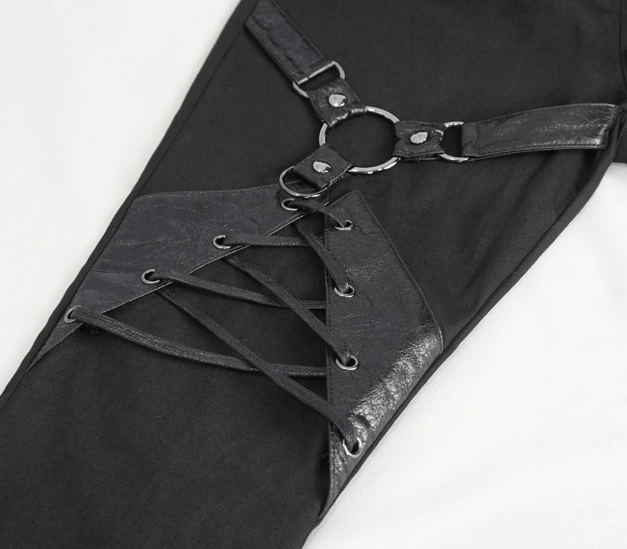 Close-up of women's slim-fit pants featuring lace-up decoration and stylish ring details for a punk vibe.
