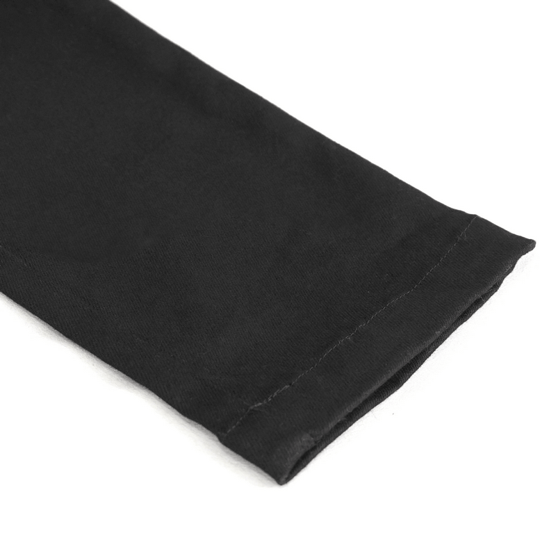 Close-up of the hem of women's slim-fit pants featuring rings and lace-up decoration in a punk style.