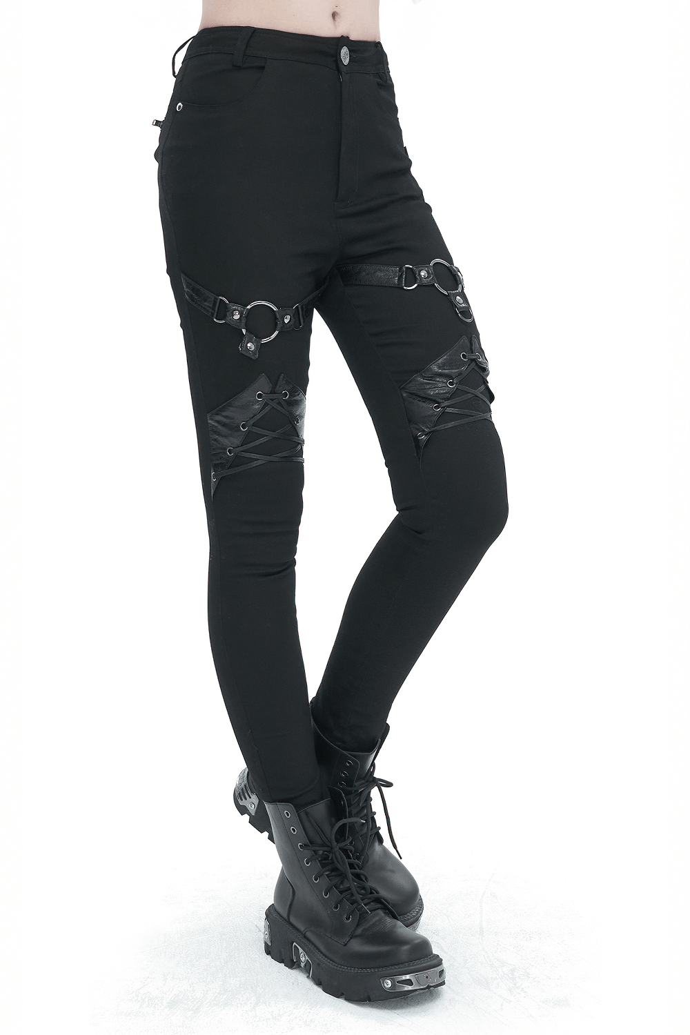 Punk style slim-fit pants with rings and lace-up details, paired with edgy black combat boots.