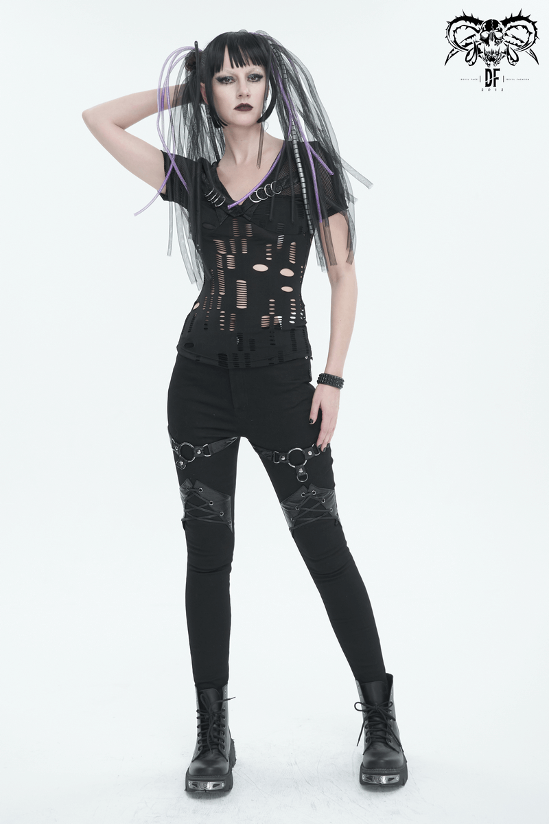 Edgy slim-fit pants with rings and lace-up details, styled for a punk look with black boots and unique hair.