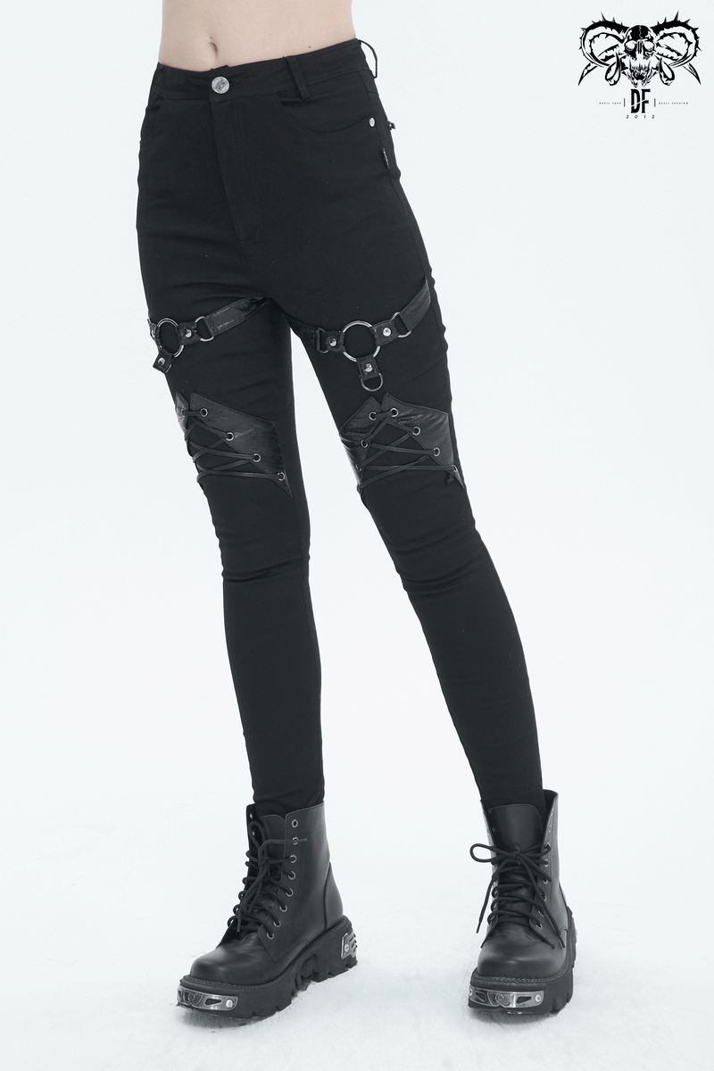 Women's slim-fit punk pants with lace-up and ring details, featuring stylish zipper pockets and edgy black design.