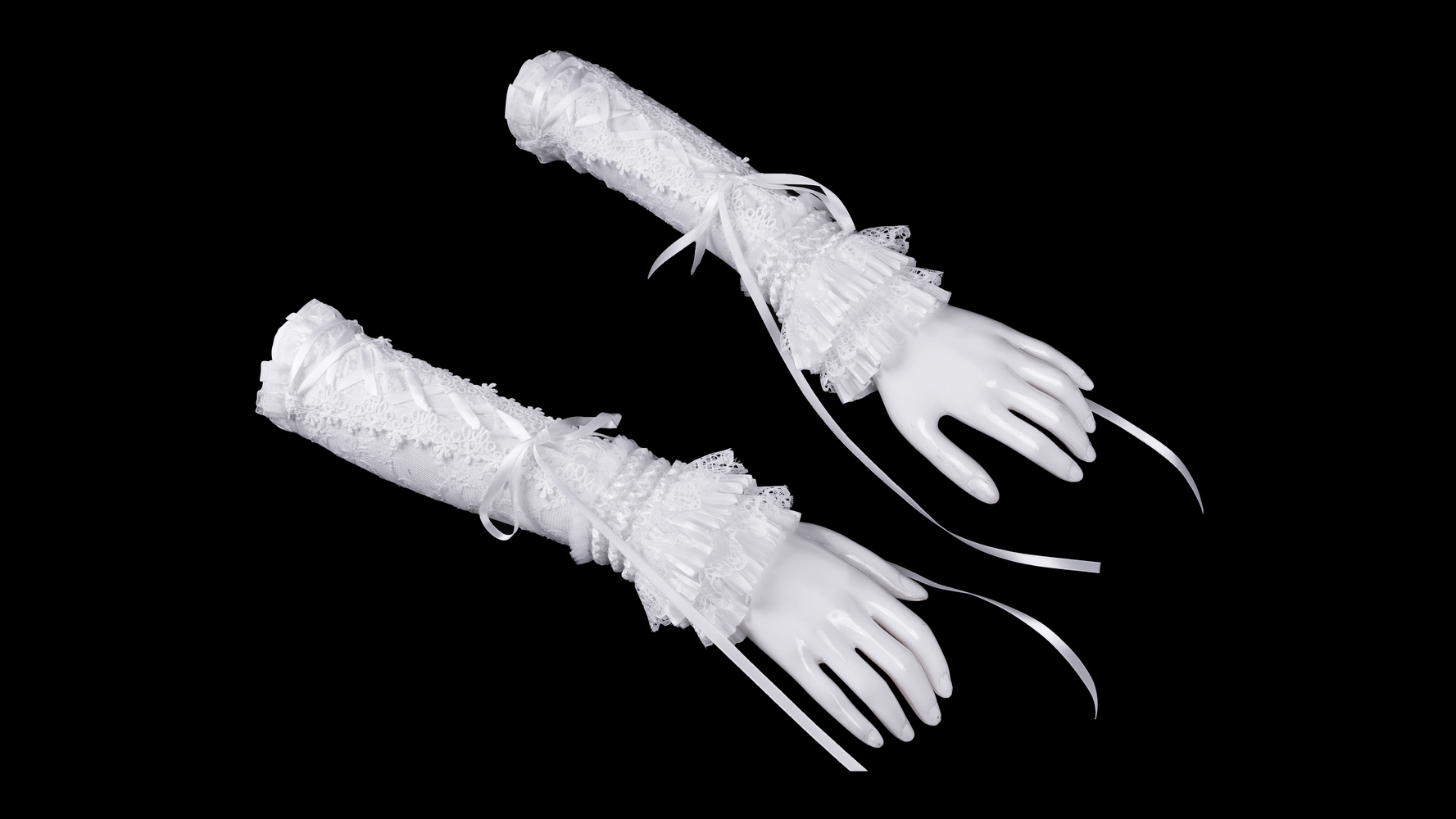 Sophisticated bridal lace fingerless gloves with ruffled accents and ribbons, perfect for weddings and special occasions.