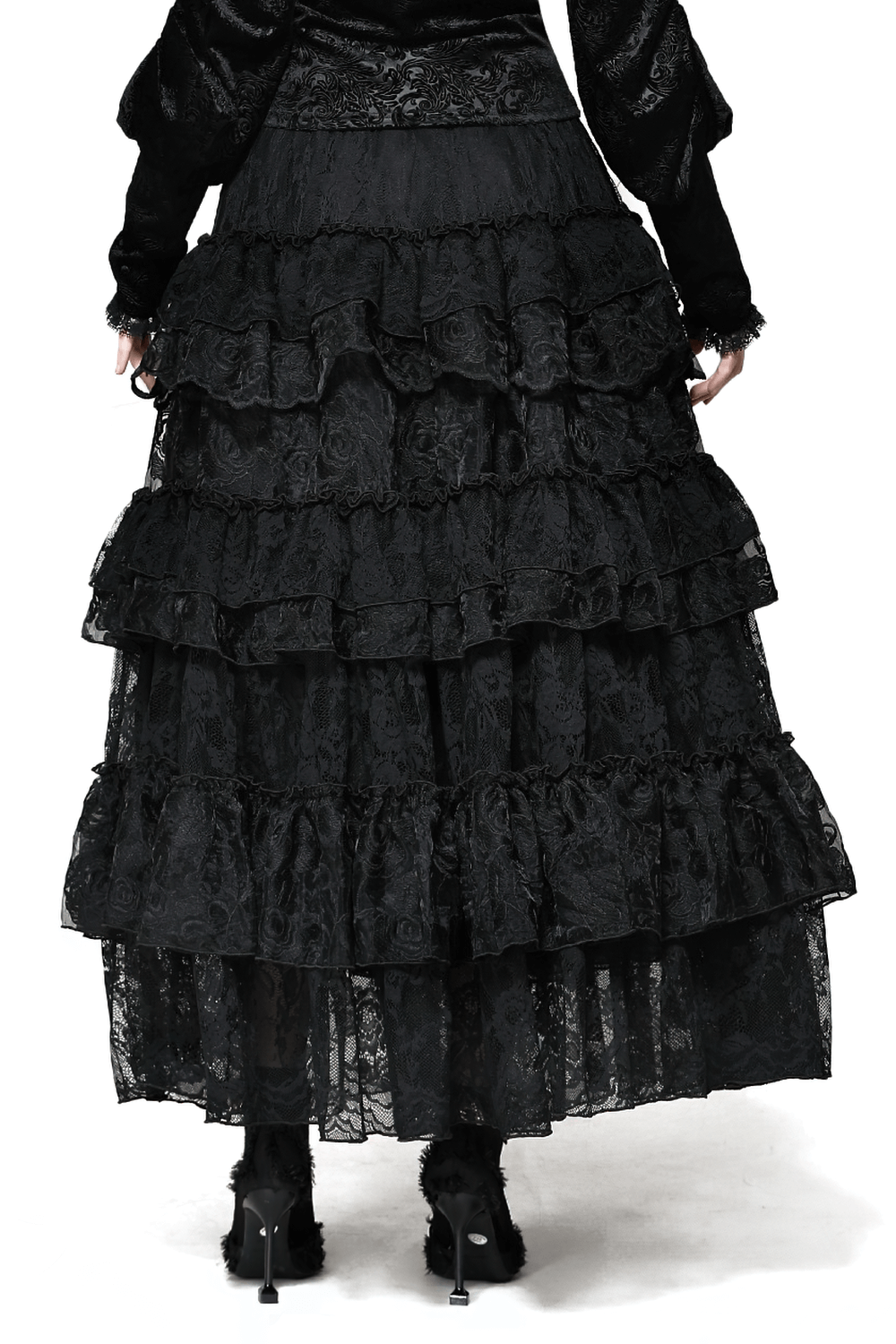 Elegant black lace tiered skirt showcasing intricate ruffle details, perfect for any chic occasion.