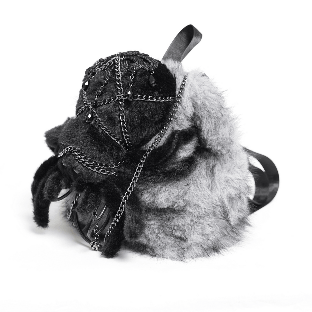 Spider Backpack with Faux Fur and Metal Chain Details featuring fuzzy grey and black fabric, chains, and skull charms.