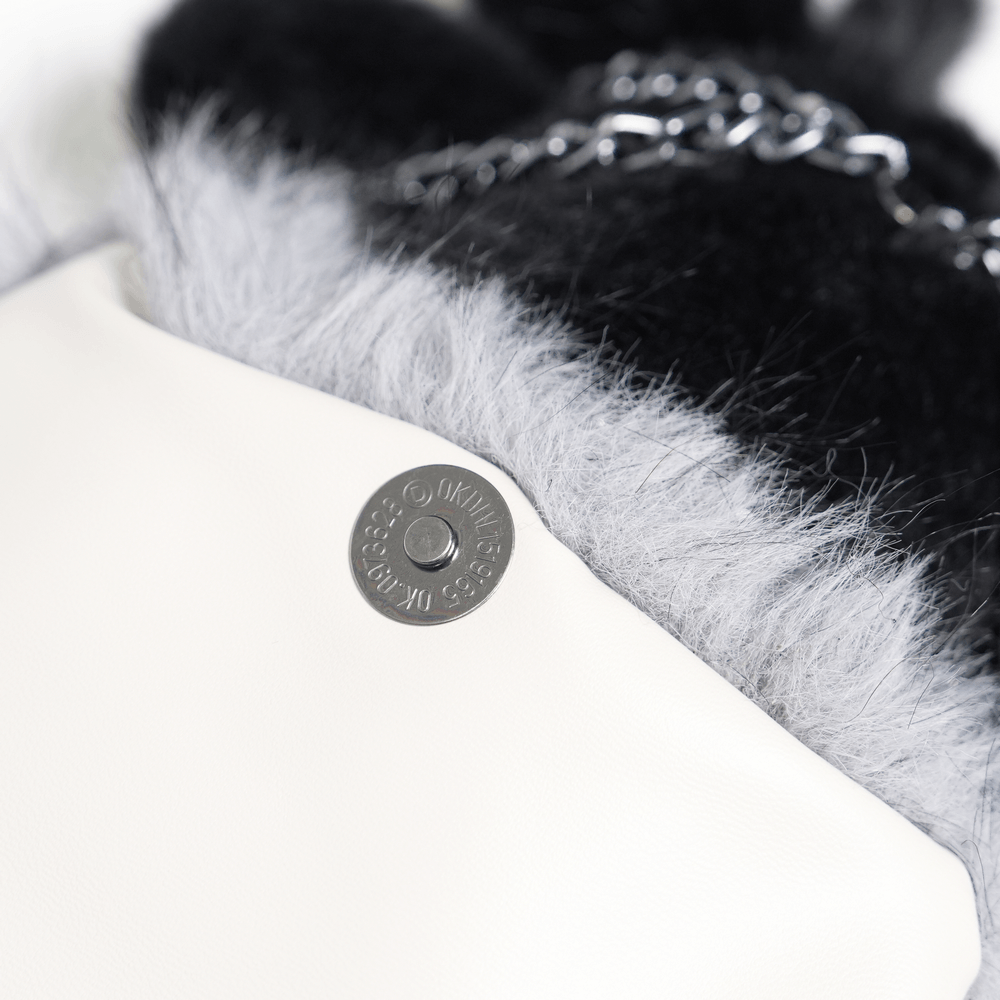 Close-up of the Spider Backpack with Faux Fur and Metal Chain Details showing fuzzy grey and black materials.