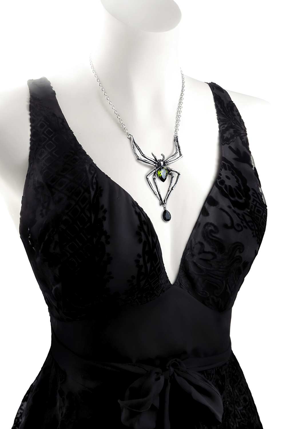 Gothic spider necklace with green and black Austrian crystals on a black dress, showcasing dramatic elegance.