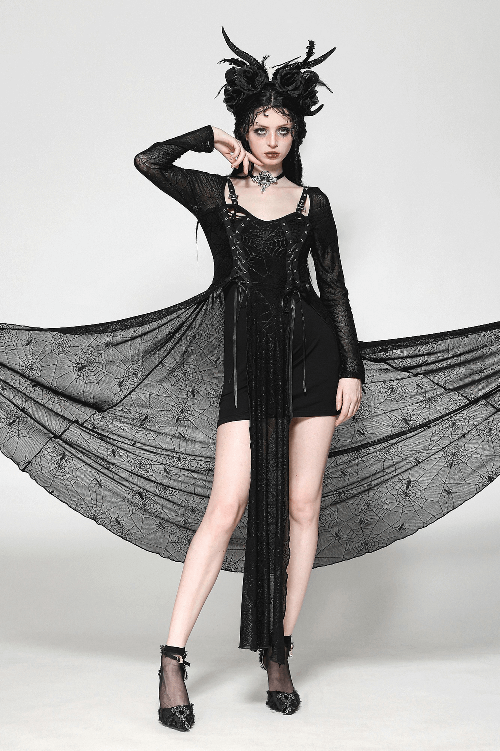 Spiderweb lace-up dress with sheer sleeves, stylishly displayed by a model in a dramatic pose, perfect for gothic fashion lovers.