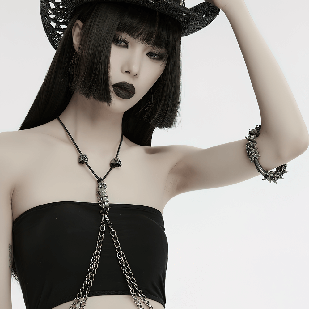 Trendy model showcasing a spike-adorned metal bracelet and edgy fashion accessories.