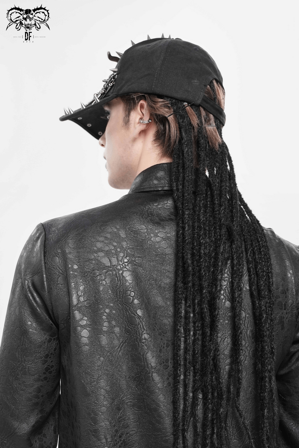 Spiked Bull Skull Chain Gothic Baseball Cap for Rockers worn by a model in a black leather jacket.