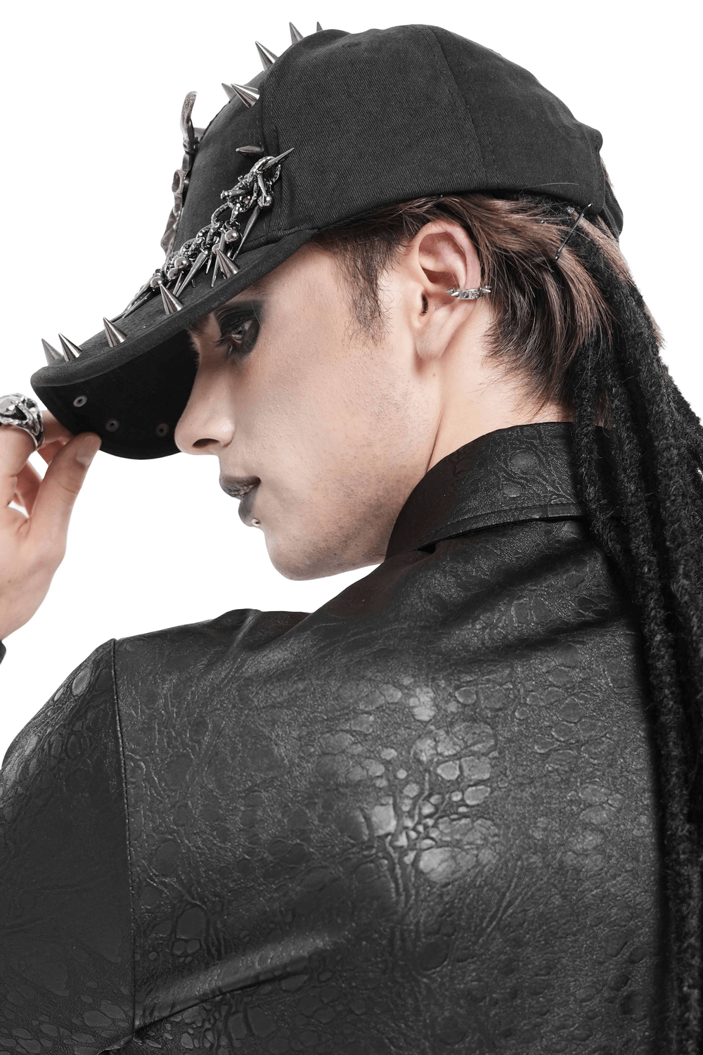 Spiked Bull Skull Chain Gothic Baseball Cap for Rockers worn by a model with dreadlocks, showcasing spikes and chains.