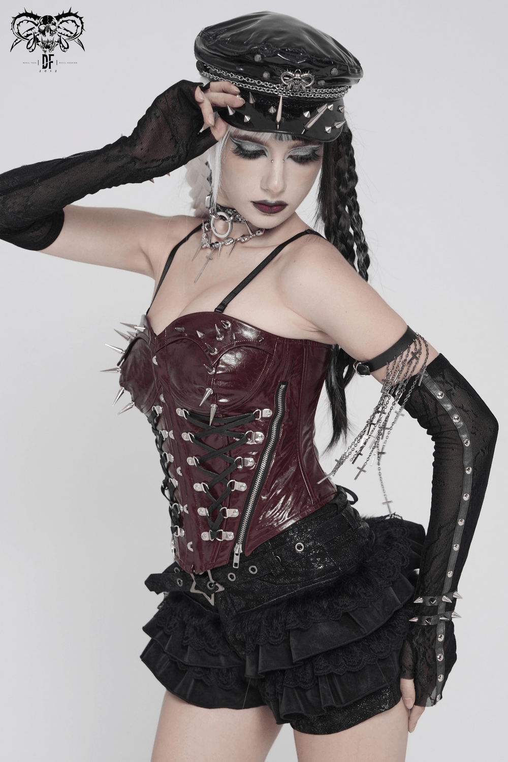 Spiked Burgundy Faux Leather Gothic Corset Top with Zips worn by model, featuring studs and lace-up back.
