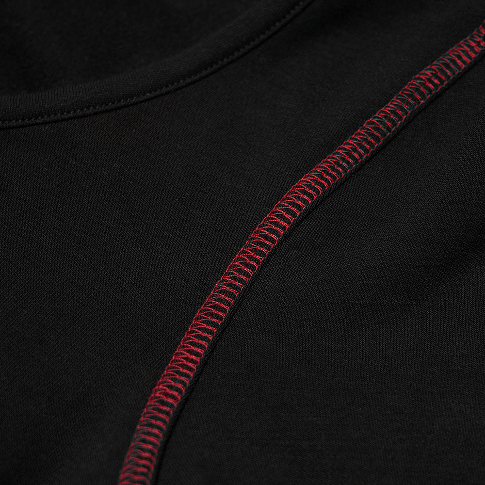 Close-up of black crop top fabric with striking red stitching detail, showcasing edgy punk style.