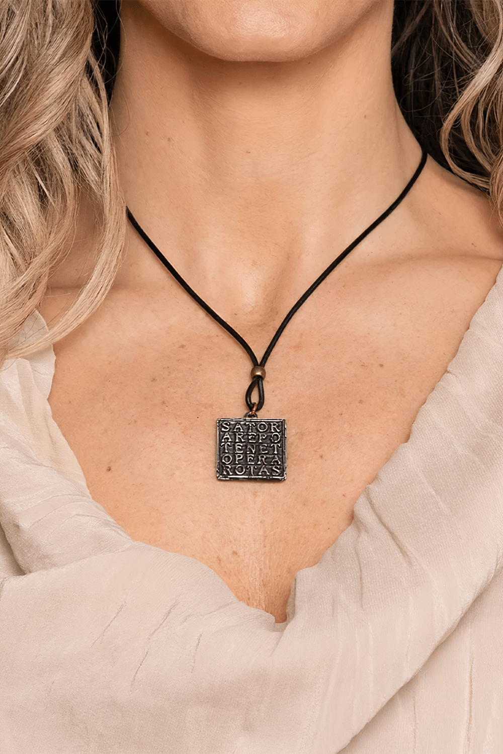 Square Latin Palindrome Gothic Pewter Pendant showcasing the ancient SATOR square amulet worn by a model.