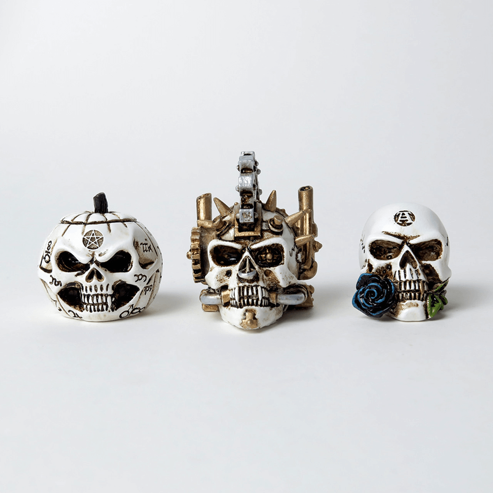 Steampunk skull miniatures with intricate gear and spike detailing, perfect for collectors and unique gifts.