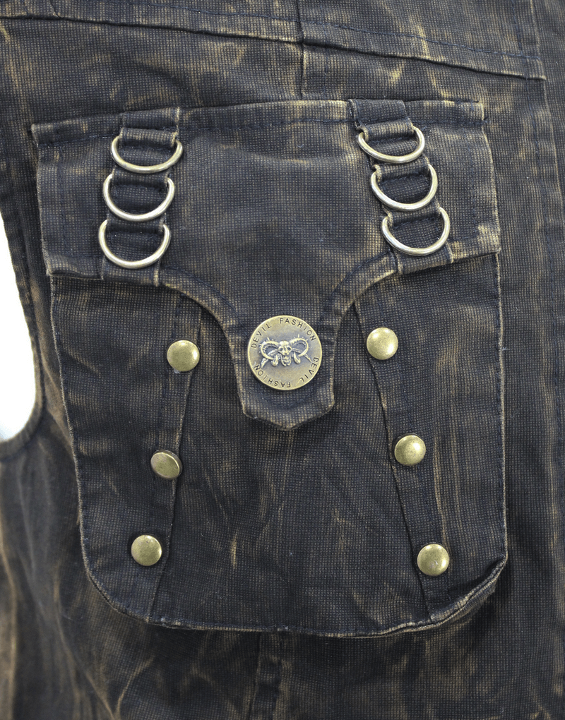 Close-up of steampunk vest pocket with bronze rivets and metallic rings, featuring vintage distressed fabric design.