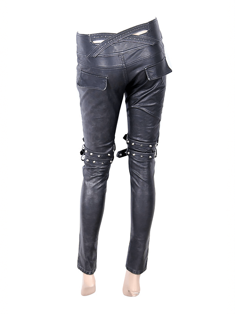 Back view of women's steampunk black PU leather pants with silver rivets and decorative zippers.