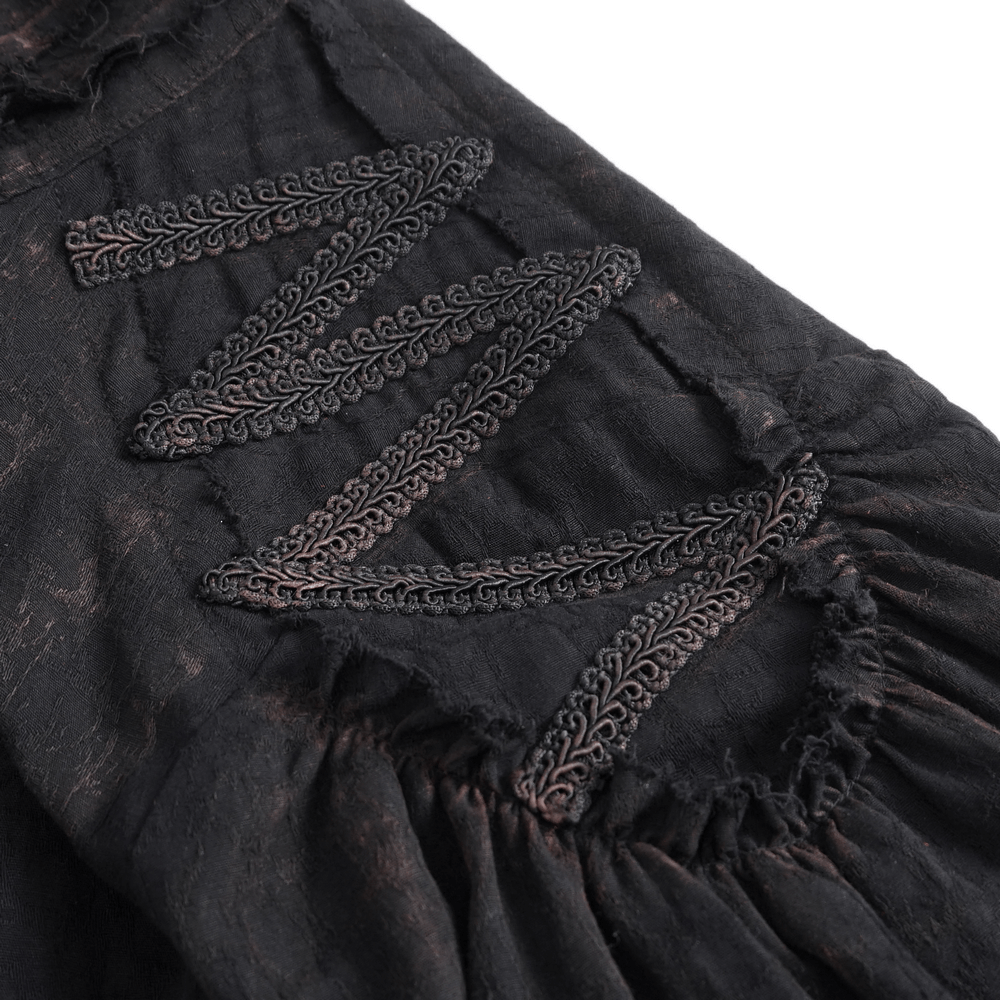 Close-up of intricate lace detailing on a steampunk black ruffle shirt, showcasing gothic charm and retro flair.