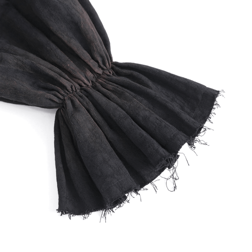 Close-up of the ruffled sleeve detail on a steampunk black shirt, showcasing gothic elegance and unique texture.