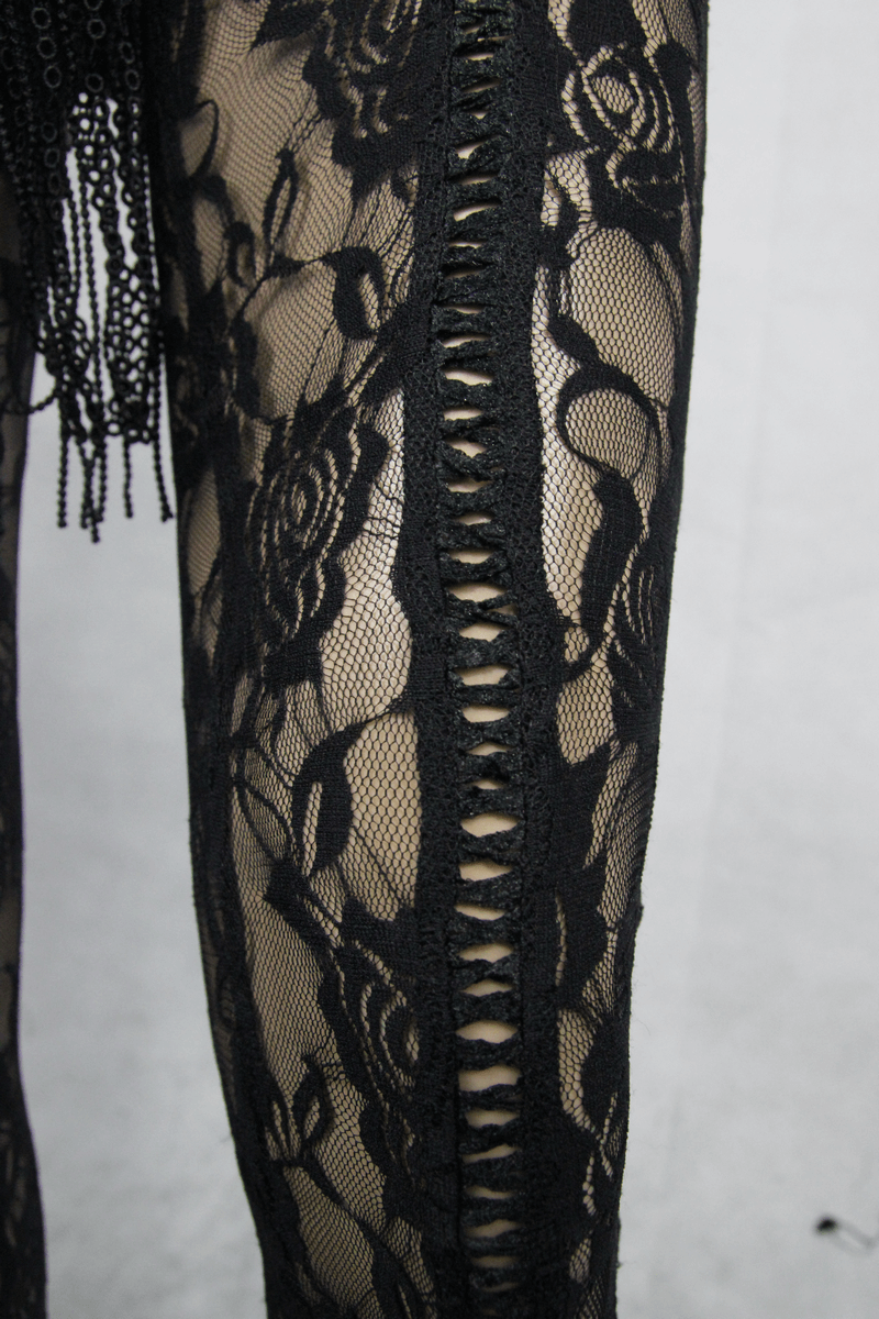 Close-up of black lace leggings showcasing floral patterns and stylish cutouts perfect for steampunk fashion.