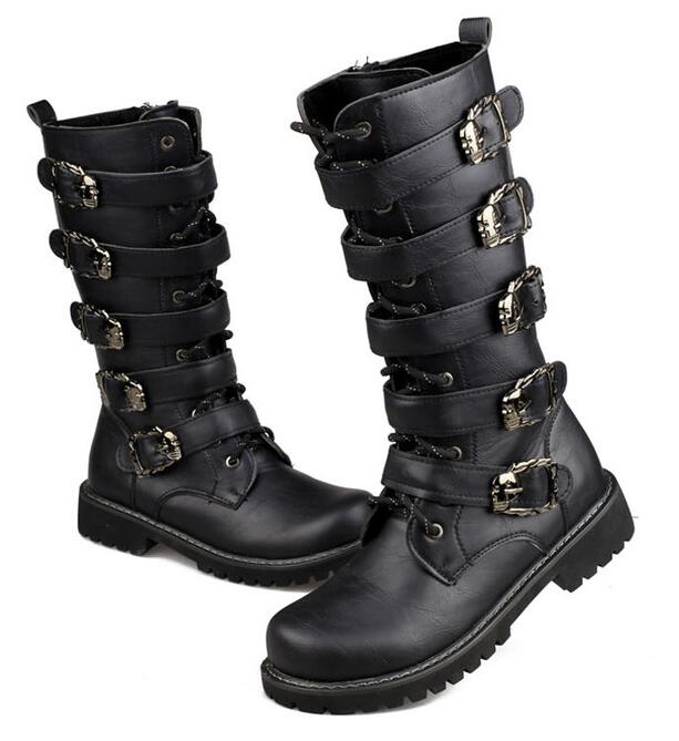 Steampunk boots with skull buckles, mid-calf gothic combat footwear for a stylish rock festival look.