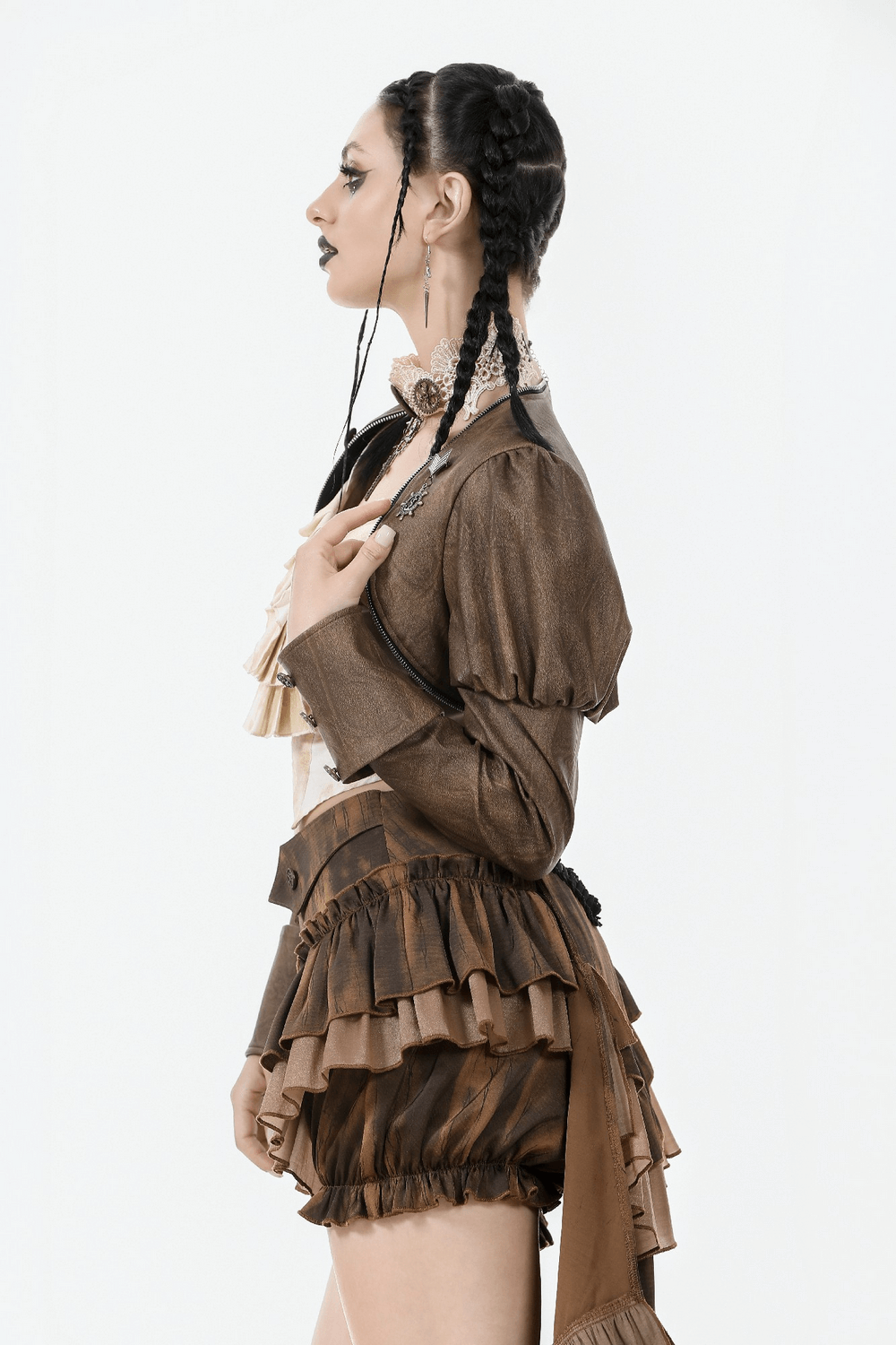 Model showcasing a steampunk brown PU leather bolero shrug jacket with puffed sleeves and ruffled shorts.