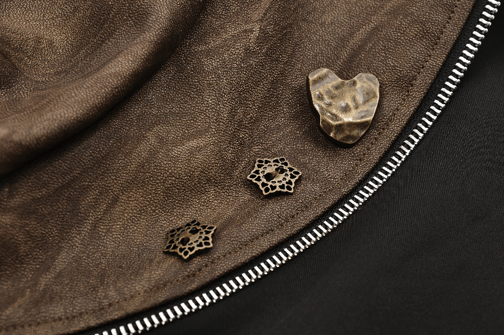 Close-up of vintage badges on brown PU leather, showcasing intricate designs for steampunk or gothic fashion.