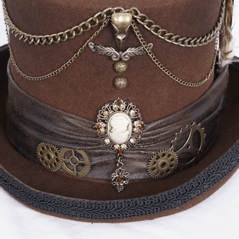 Close-up of a Victorian-inspired steampunk brown top hat with chains, gears, and a vintage cameo detail.