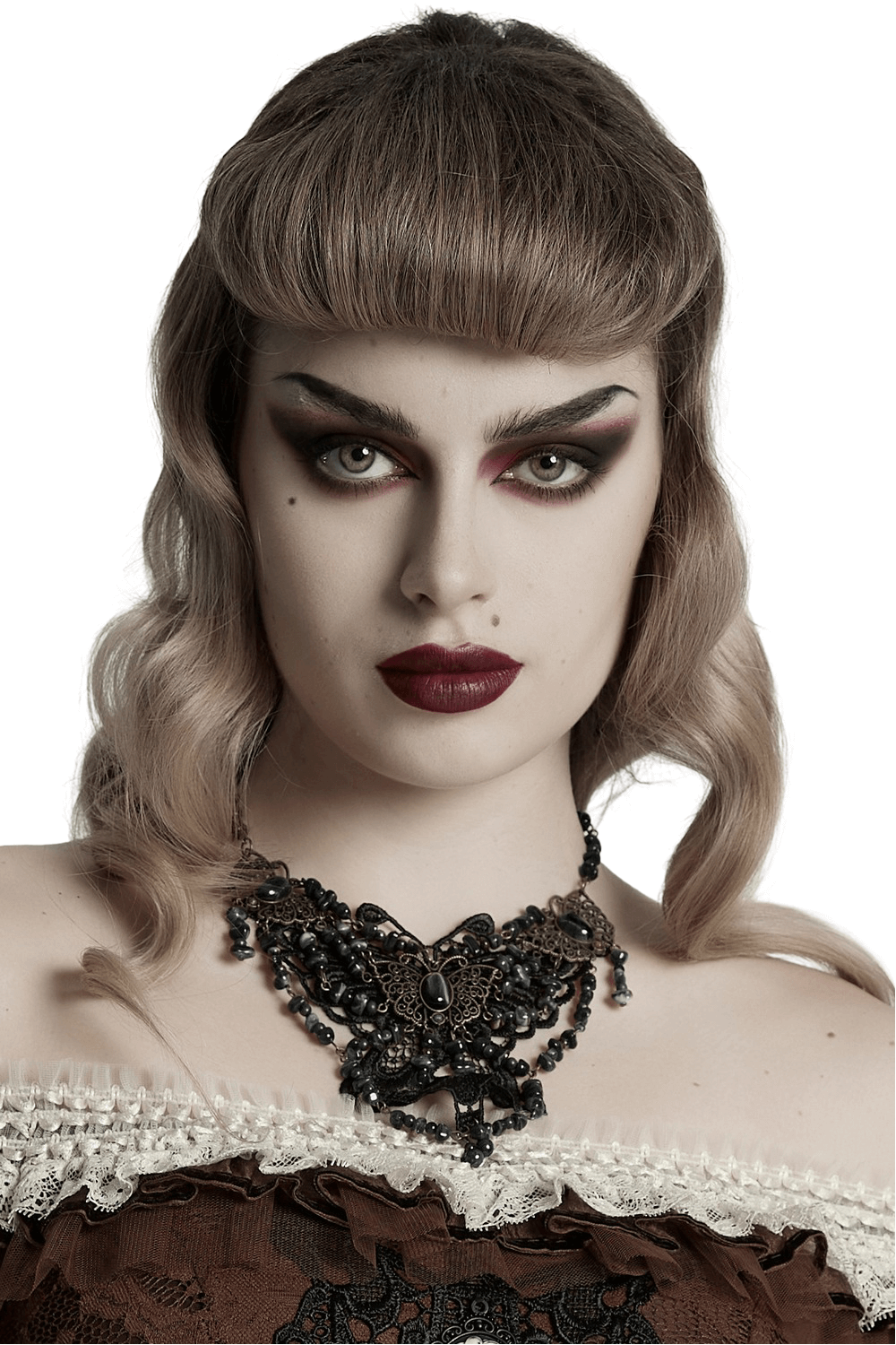 Gothic model showcasing a steampunk butterfly necklace with lace and natural stones, perfect for bold fashion statements.
