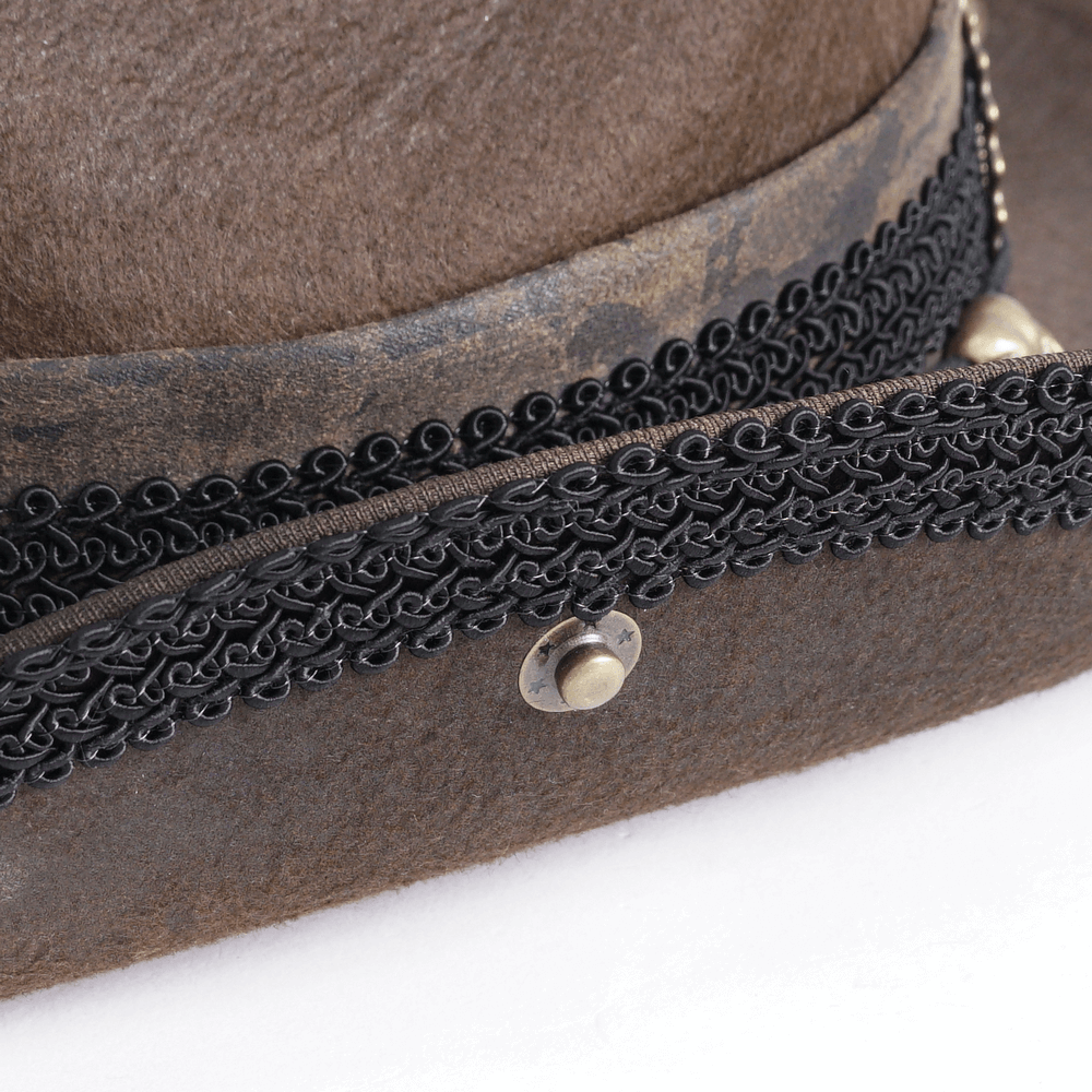 Close-up of a vintage Steampunk brown hat with intricate black detailing and mechanical embellishments.