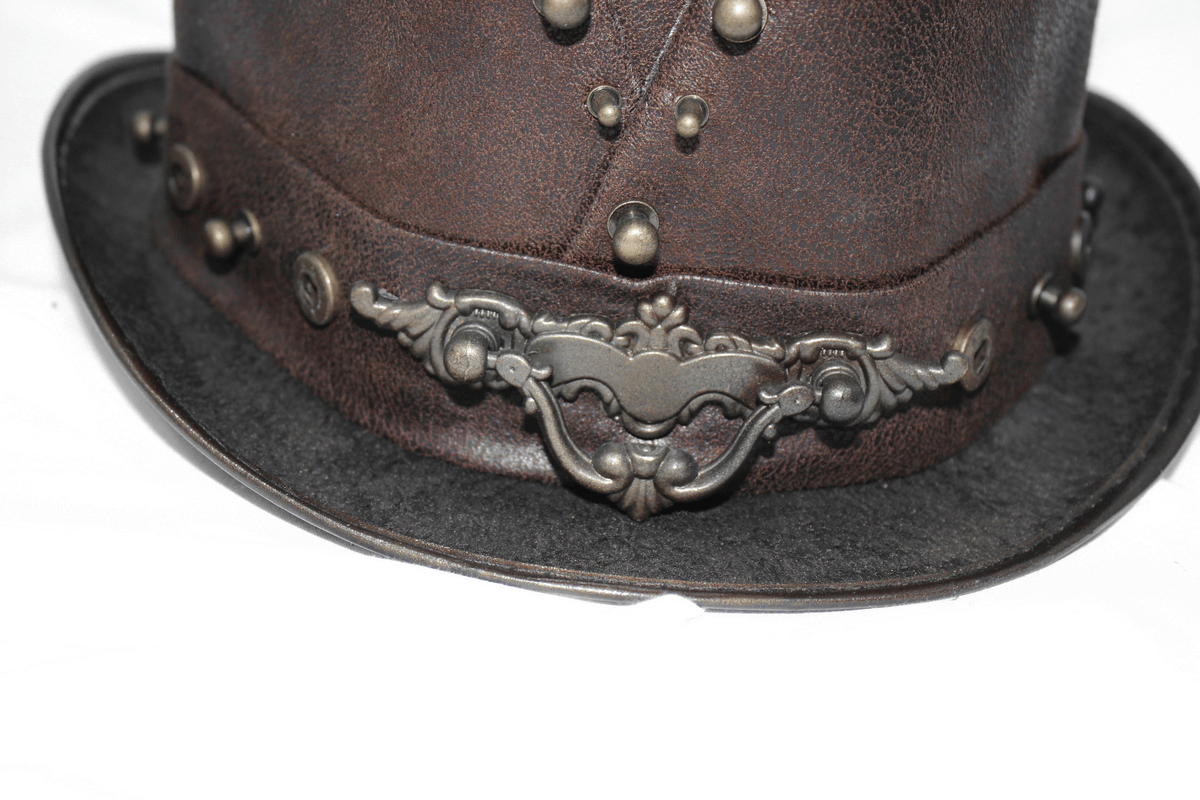 Close-up of a steampunk devil skull hat with bronze rivets and vintage design in brown PU leather.