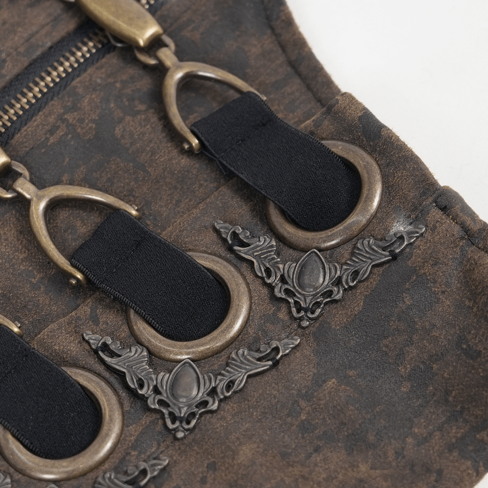 Close-up of steampunk gothic corset belt with ornate metal hooks and chain details on distressed leather finish.