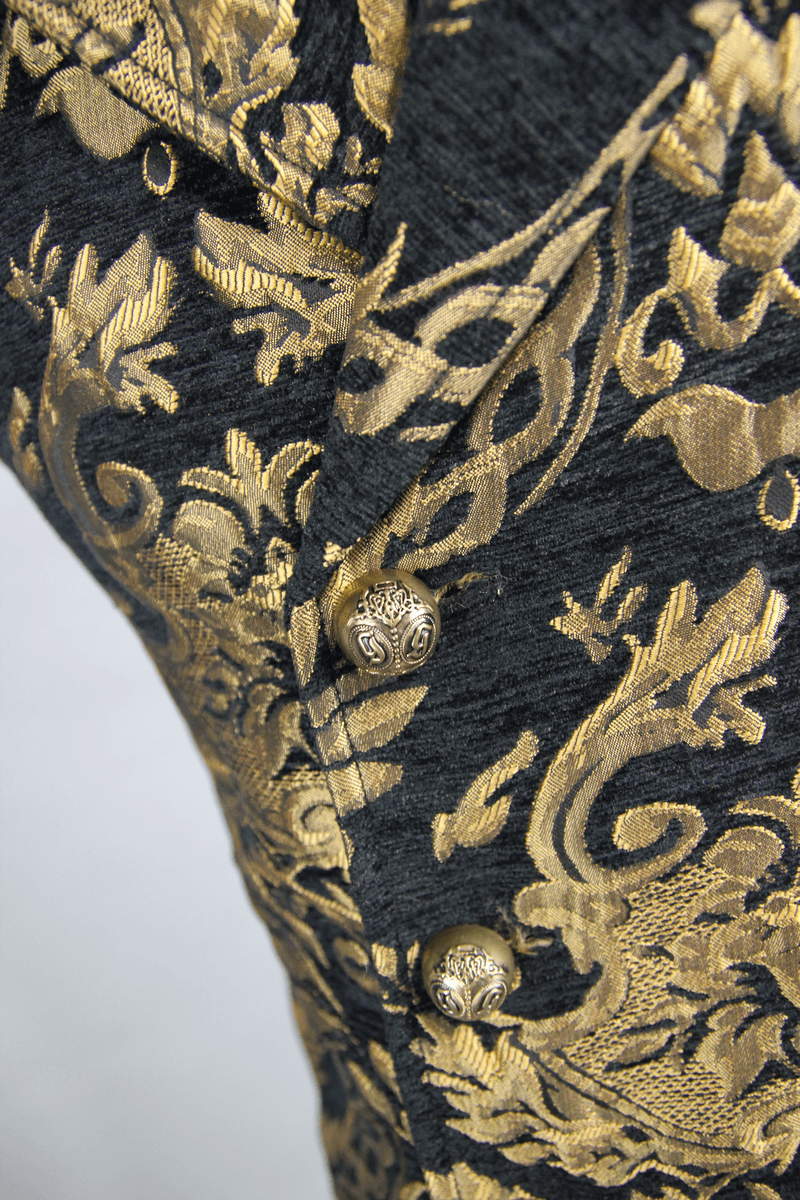 Close-up of steampunk gothic waistcoat with intricate gold embroidery and stylish buttons.