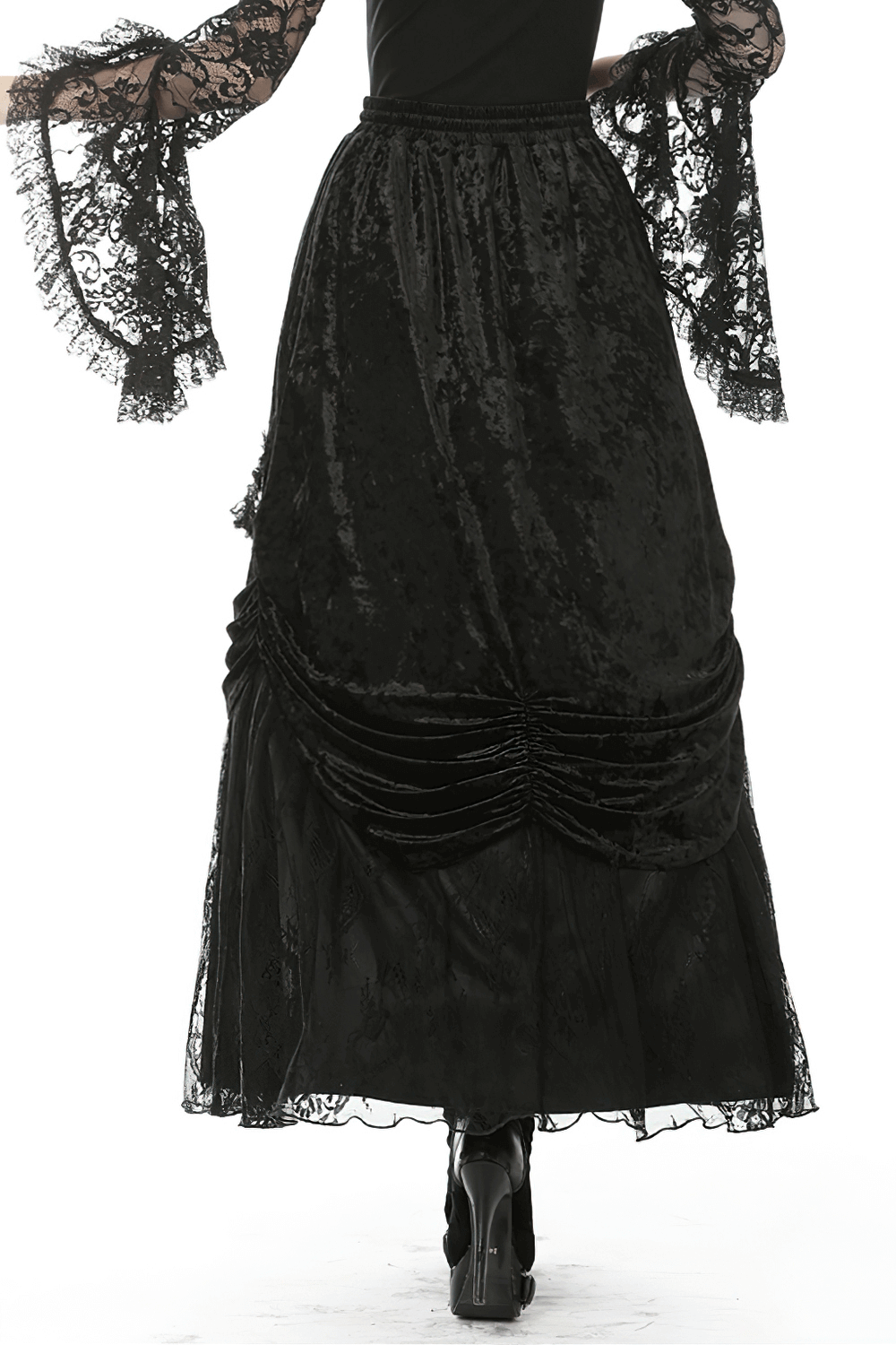 Back view of a black steampunk gothic maxi skirt with ruffles and lace, draping elegantly for a dramatic look.