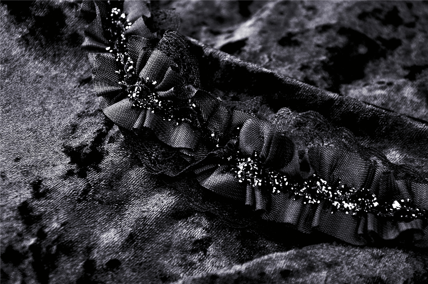 Close-up of dark ruffles and lace detail on a black Gothic maxi skirt, showcasing Victorian elegance.