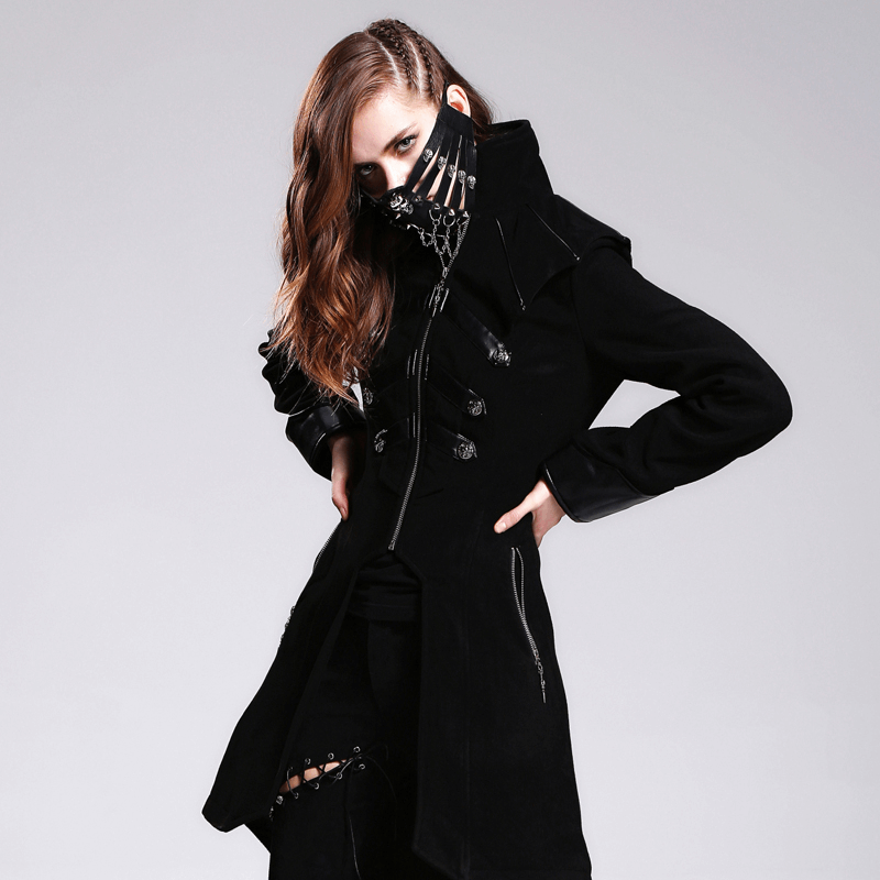 Stylish woman in a black steampunk coat and face mask with spikes, showcasing a bold gothic fashion statement.