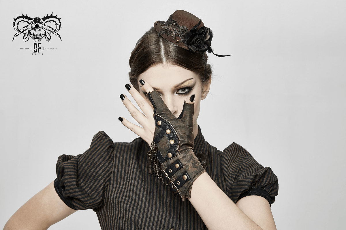 Steampunk leather gloves with rivets showcased by a model, featuring a unique asymmetrical design and stylish accessories.